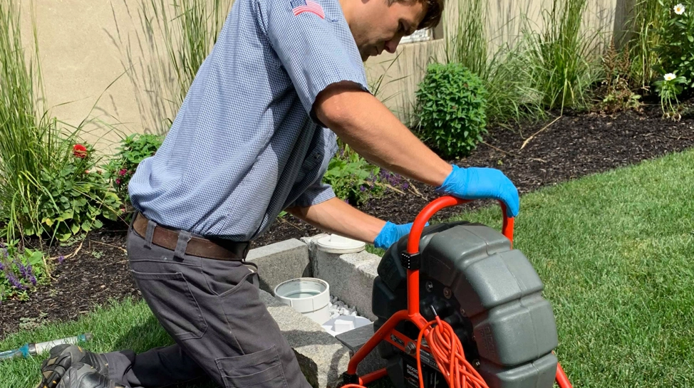 snaking a pipe for clearing and cleaning a drain