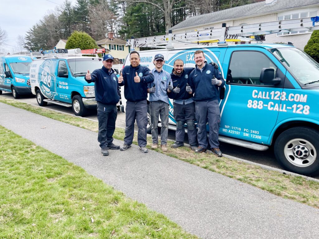 team in front of truck giving thumbs up 