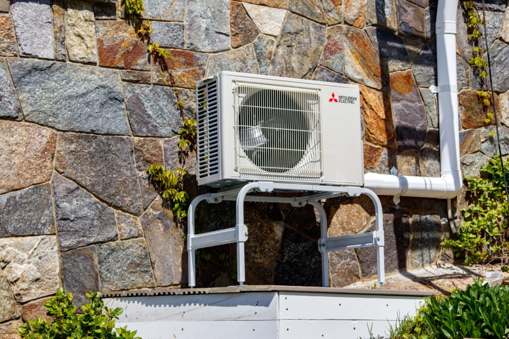 mitsubishi condenser shot outside home 