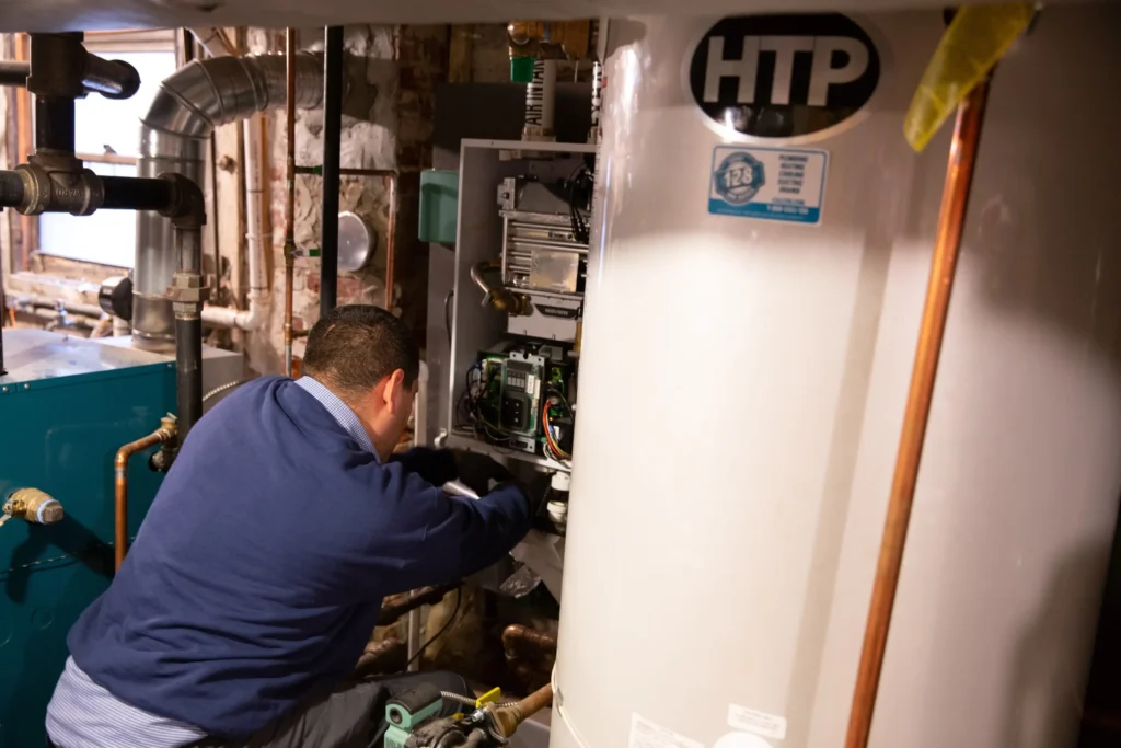 128 Plumber working on a plumbing job in Boston 