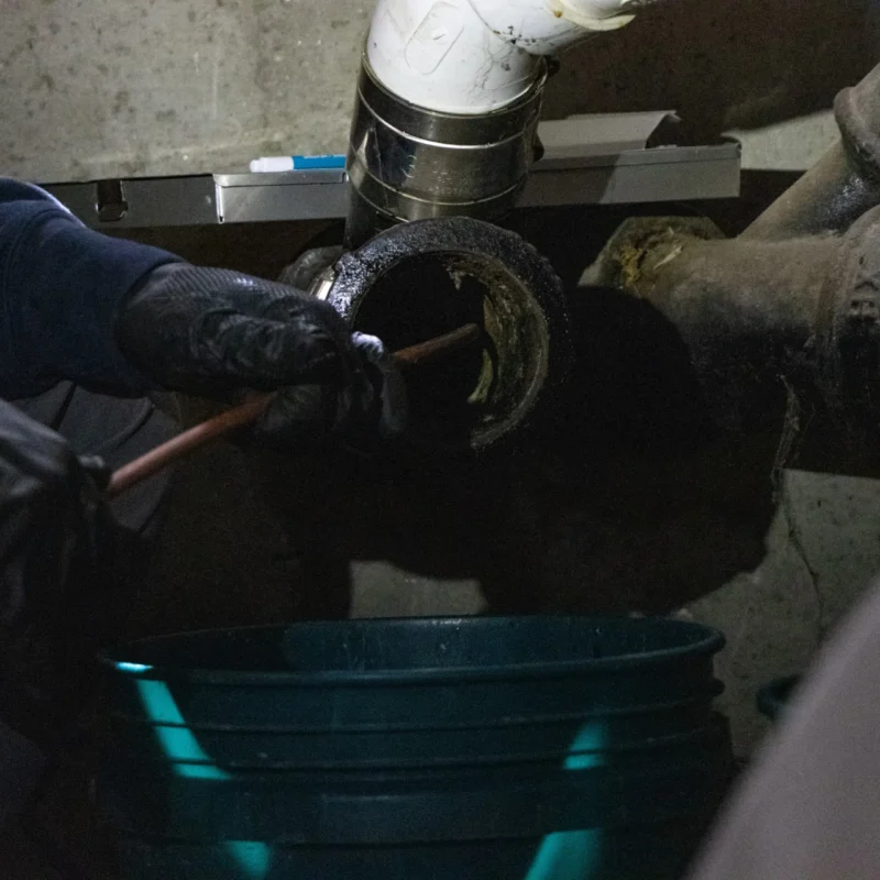 Drain cleaning in progress