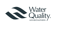 Water Quality Association logo featuring two abstract blue wave shapes and the words "Water Quality Association" in black text, endorsed by 128 Plumbing Partners.