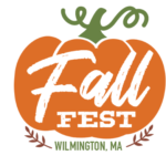 Orange pumpkin graphic with "Fall Fest" written inside and "Wilmington, MA" below, decorated with green stem and small brown leaves.