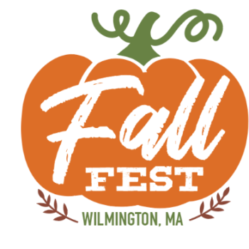 Orange pumpkin graphic with "Fall Fest" written inside and "Wilmington, MA" below, decorated with green stem and small brown leaves.