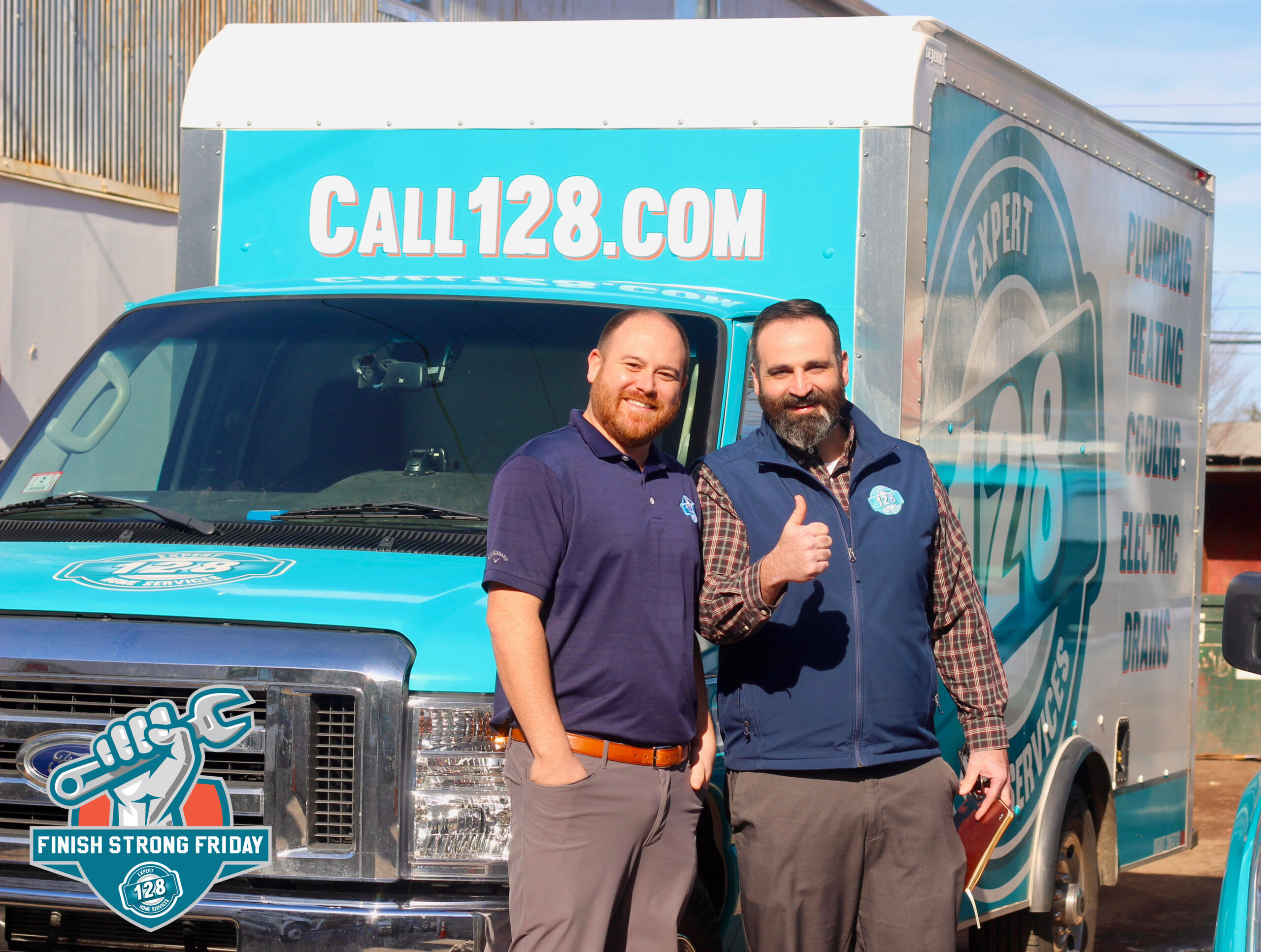 Two men stand in front of a blue and white service van branded with CALL128.COM, one smiling and the other giving a thumbs up.